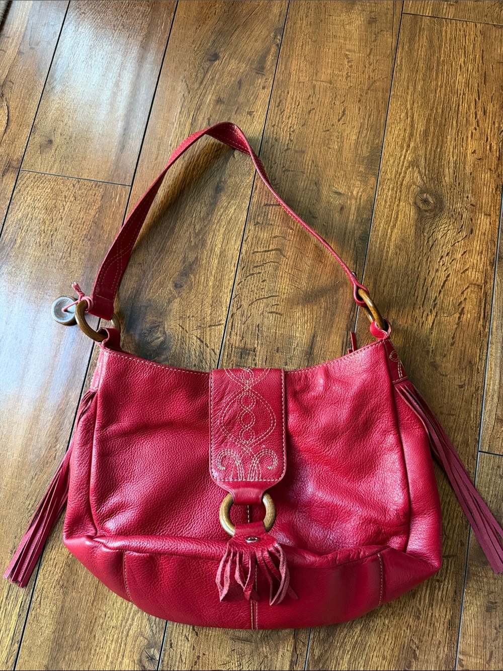 The Sak Red Leather Shoulder Bag with Tassel Ring Detail